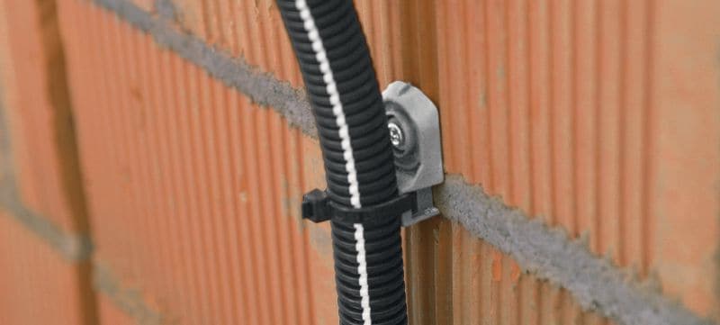X-ECT MX držač vezice za kabl Plastični držač za vezicu za kabl/zaštitnu cev predviđen za upotrebu sa šaržiranim ekserima Primene 1